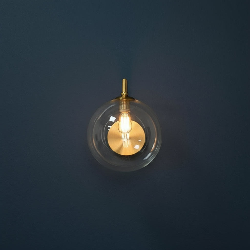 Modern Brass Wall Light | Curved Arm Clear Glass Globe Sconce Indoor