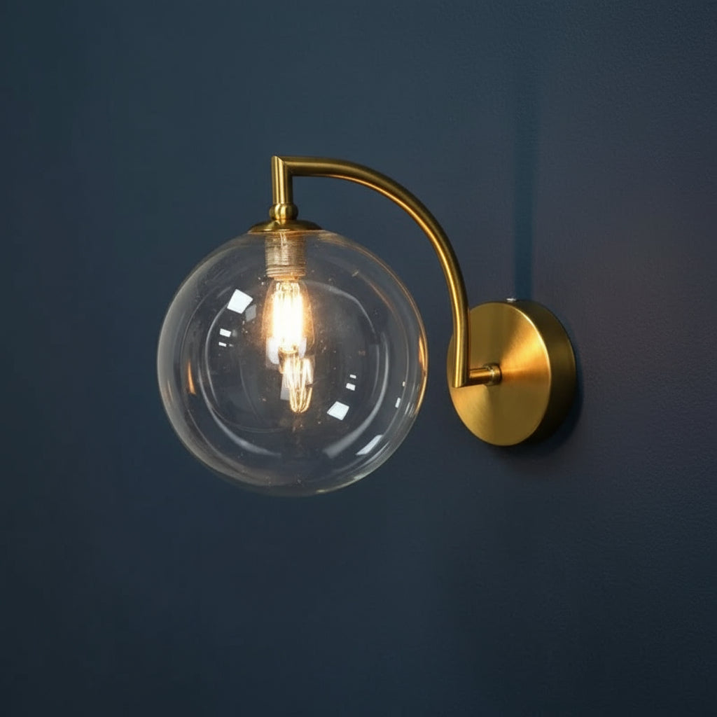 Modern Brass Wall Light | Curved Arm Clear Glass Globe Sconce Indoor