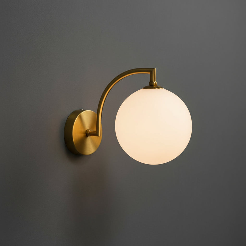 Modern Brass Wall Light | Curved Arm Clear Glass Globe Sconce Indoor